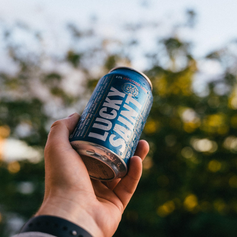 LUCKY SAINT Alcohol Free Beer - Unfiltered Lager, Case of 12 x 330ml, 0.5% Cans with Keyring | Vegan, 53 Calories Per Lager | 4 Ingredients: Pilsner Malt, Hallertau Hops, Water & Yeast