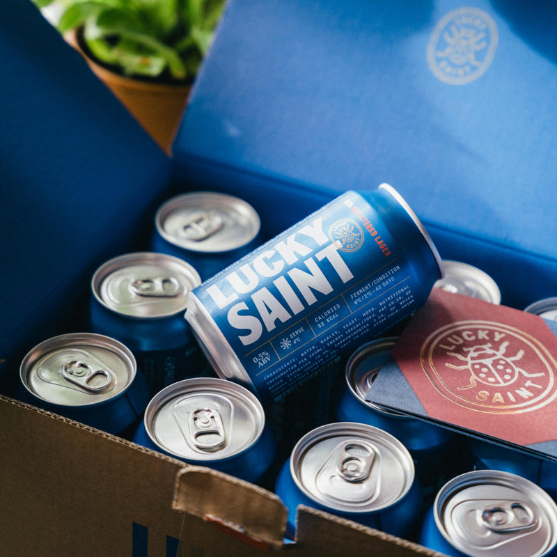 LUCKY SAINT Alcohol Free Beer - Unfiltered Lager, Case of 12 x 330ml, 0.5% Cans with Keyring | Vegan, 53 Calories Per Lager | 4 Ingredients: Pilsner Malt, Hallertau Hops, Water & Yeast